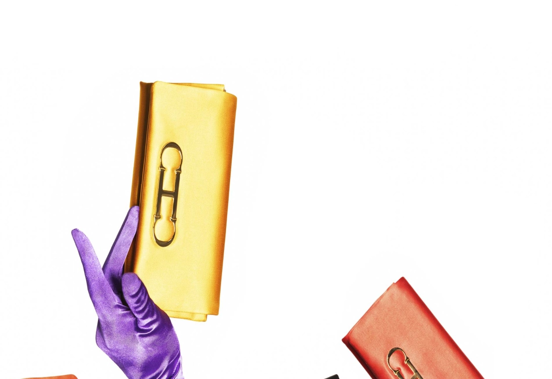 The word chic is synonymous with the House of Herrera, and the Initials Insignia Soft clutch adds a colorful finishing touch to that point.