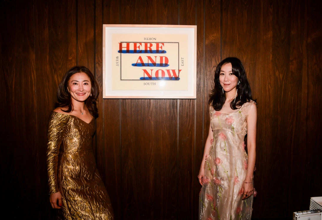 ARTLINE founders Ji Park Kwak and Rosa Suehyun Kim in front of Ed Ruscha