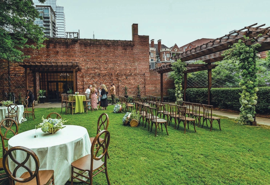 The outdoor lawn at the Trellis Room sets a picturesque backdrop for outdoor ceremonies and cocktail hours. PHOTO COURTESY OF THE TRELLIS ROOM
