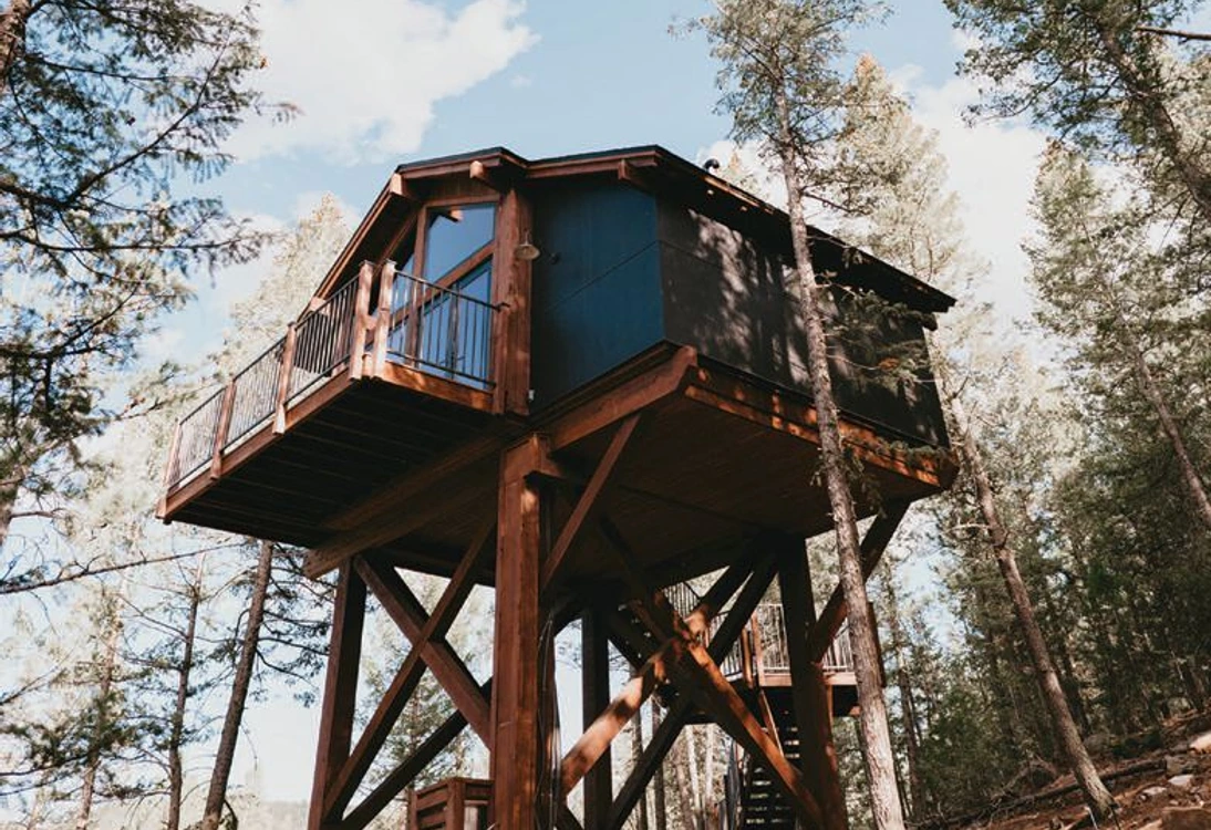 Perched among the pines, Juniper’s treehouses create an elevated escape.