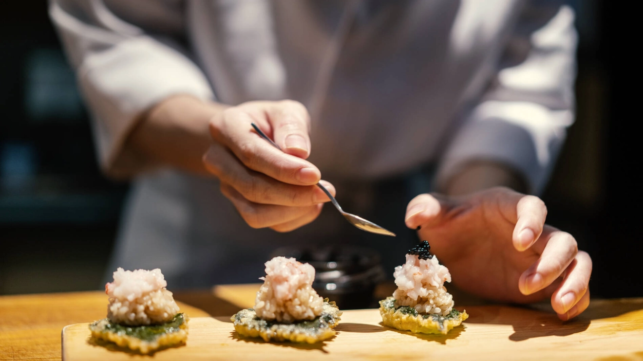 Close up of chef making nigiri sushi