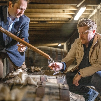 Gregg Glass of The Dalmore and Bay Area architect Ben Dobbin taste from one of the brandâs storied casks in Scotland