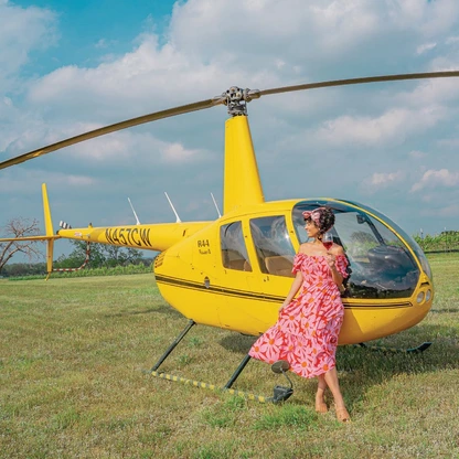 Jessica Serna enjoys a glass of wine after her flight over Fredericksburg. PHOTO COURTESY OF MY CURLY ADVENTURES