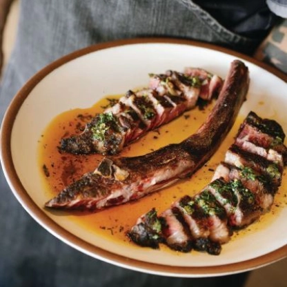 Nelson sources the 32-ounce dry-aged tomahawk steak from Walter Angus ranch in Hudson, Colorado. PHOTO BY LAUREN STORER PHOTOGRAPHY