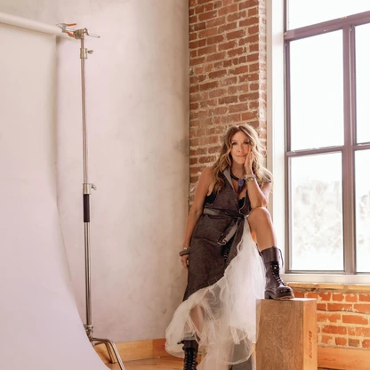 Dr. Christina Rahm in a piece from the runway collection of Merci Dupre Clothiers, her sustainable fashion brand. photography by MARY CRAVEN DAWKINS hair and makeup by HELEN BUSH