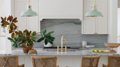 The bones of the kitchen are mostly neutral and feature custom cabinetry by Bloomfield Originals in Farrow & Ballâs Slipper Satin. A teal Quartzite with heavy veining was chosen for the backsplash and countertops photo by ALLISON ELEFANTE styling by CATE RAGAN