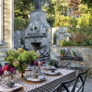 Caroline Ervin carved out a gorgeous space, including an outdoor fireplace and cozy seating. PHOTO BY KATE WICHLINSKI