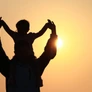 silhouette of father and daughter