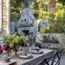 Caroline Ervin carved out a gorgeous space, including an outdoor fireplace and cozy seating. PHOTO BY KATE WICHLINSKI