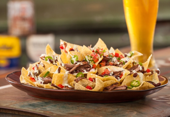 Craving nachos? Whether you like them with creamy queso, spicy salsa or tangy pickled jalapeños, we’ve rounded up the best Nashville spots for this Tex-Mex favorite.