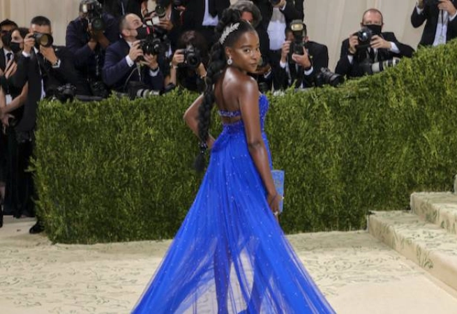 In true Amanda Gorman fashion, the poet graced her first Met Gala red carpet in a both thoughtful and stunning look.