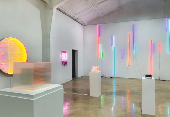 Calling on creative conversations for all who have entered the building at Ro2 Art—Dallas-based Carmen Menza presents “Patterns of Disturbance.” On display through Jan. 11, the show summons themes of perception, reflection, disquiet, and hope through neon text-based statements and light-based works.