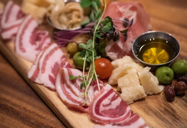 Calling all charcuterie lovers! Assorted cured meats, a variety of hard and soft cheeses, olives, crackers, tapenade, and jam,—what could possibly be better?