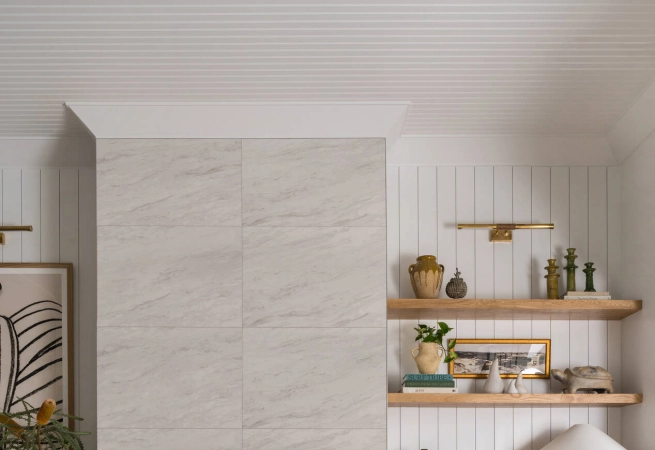 After settling into Crown Point, a retired couple enlisted full-service design firm Kristyn Harvey Interiors to reimagine their cool-toned space into a warm, eclectic home that could accommodate the entire family.