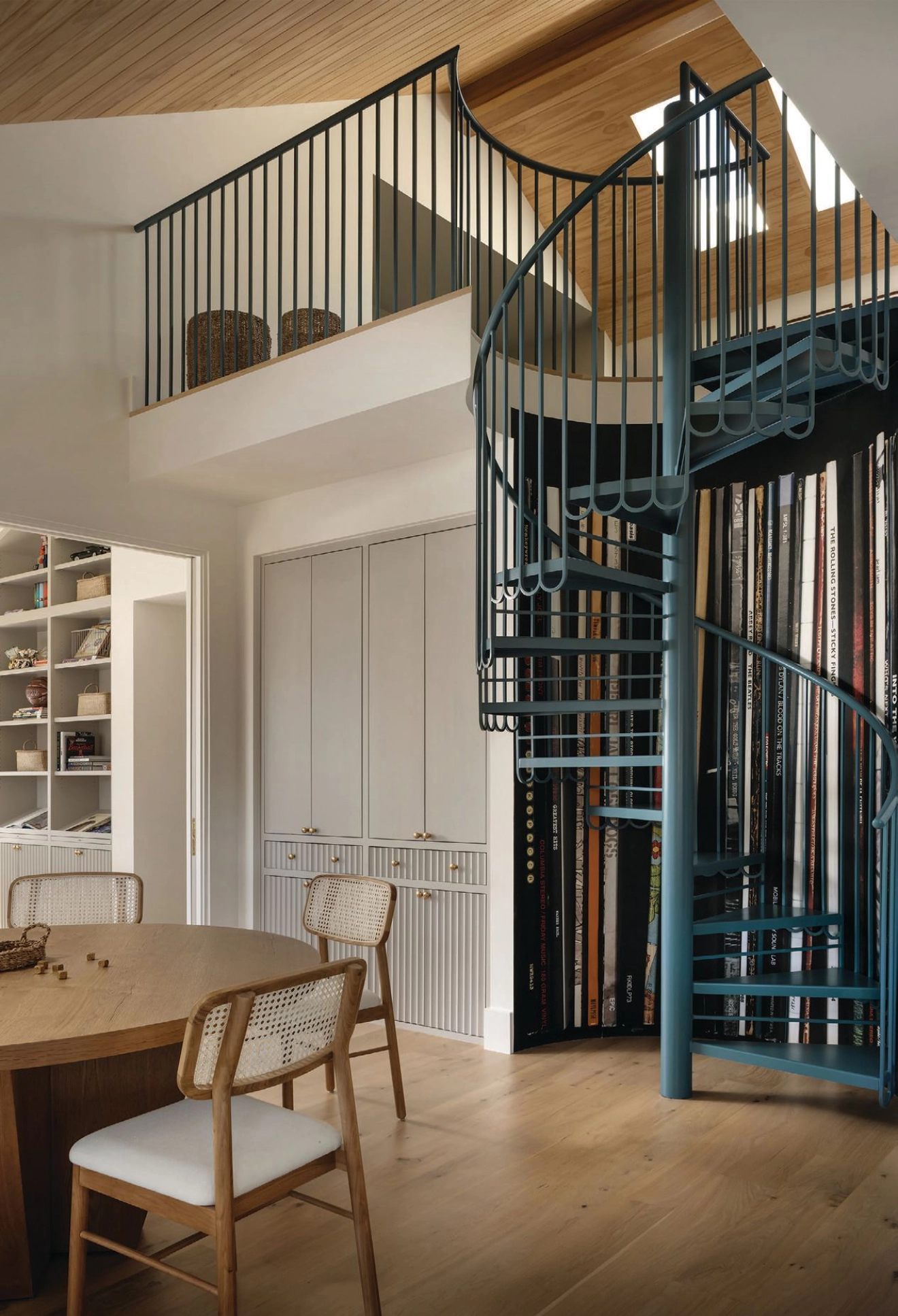 Having a playroom above the breakfast nook is a clever way to take advantage of bonus loft space. Interiors photography by CHASE DANIELS