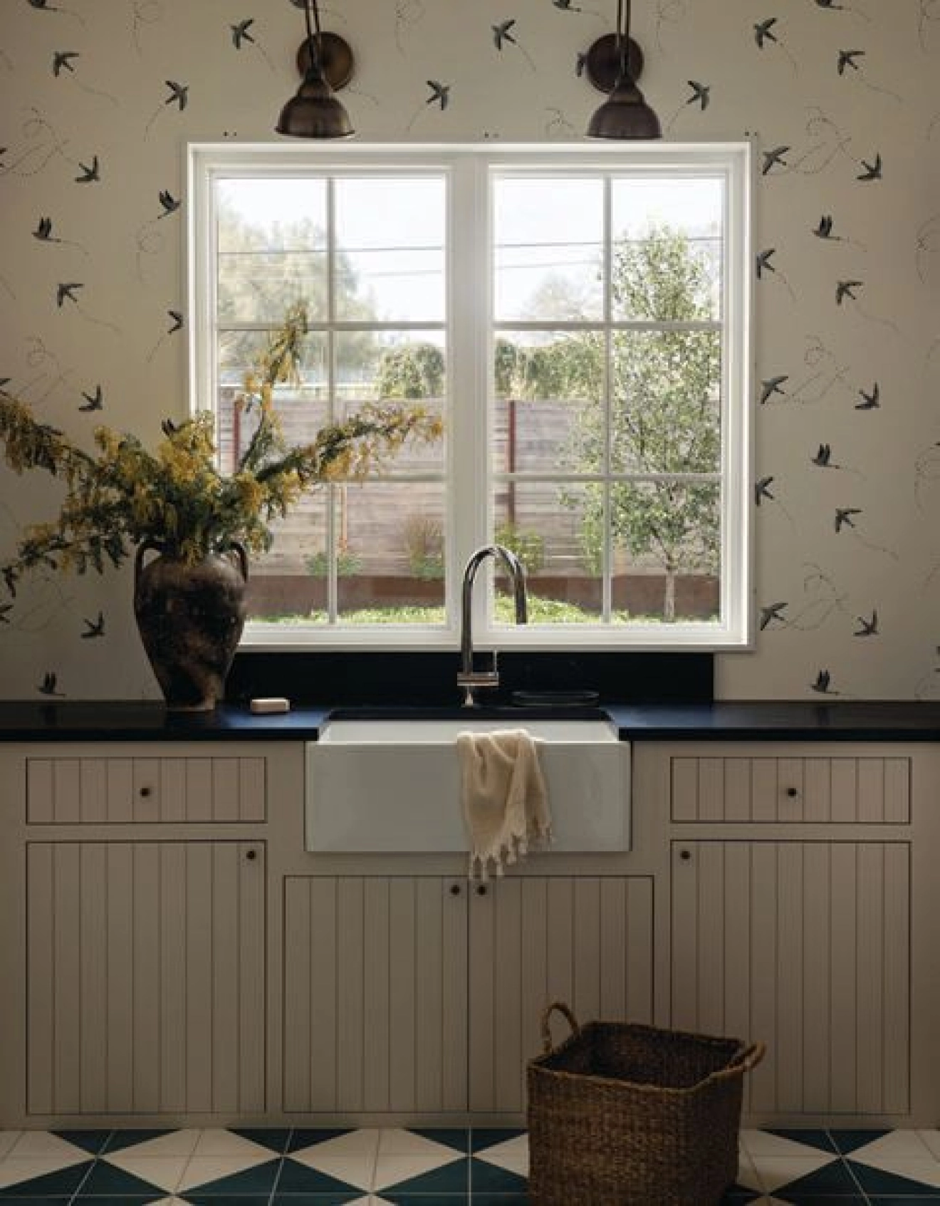 Playful finishes and color choices in the home’s utility spaces add interest, while keeping the design on theme. Interiors photography by CHASE DANIELS