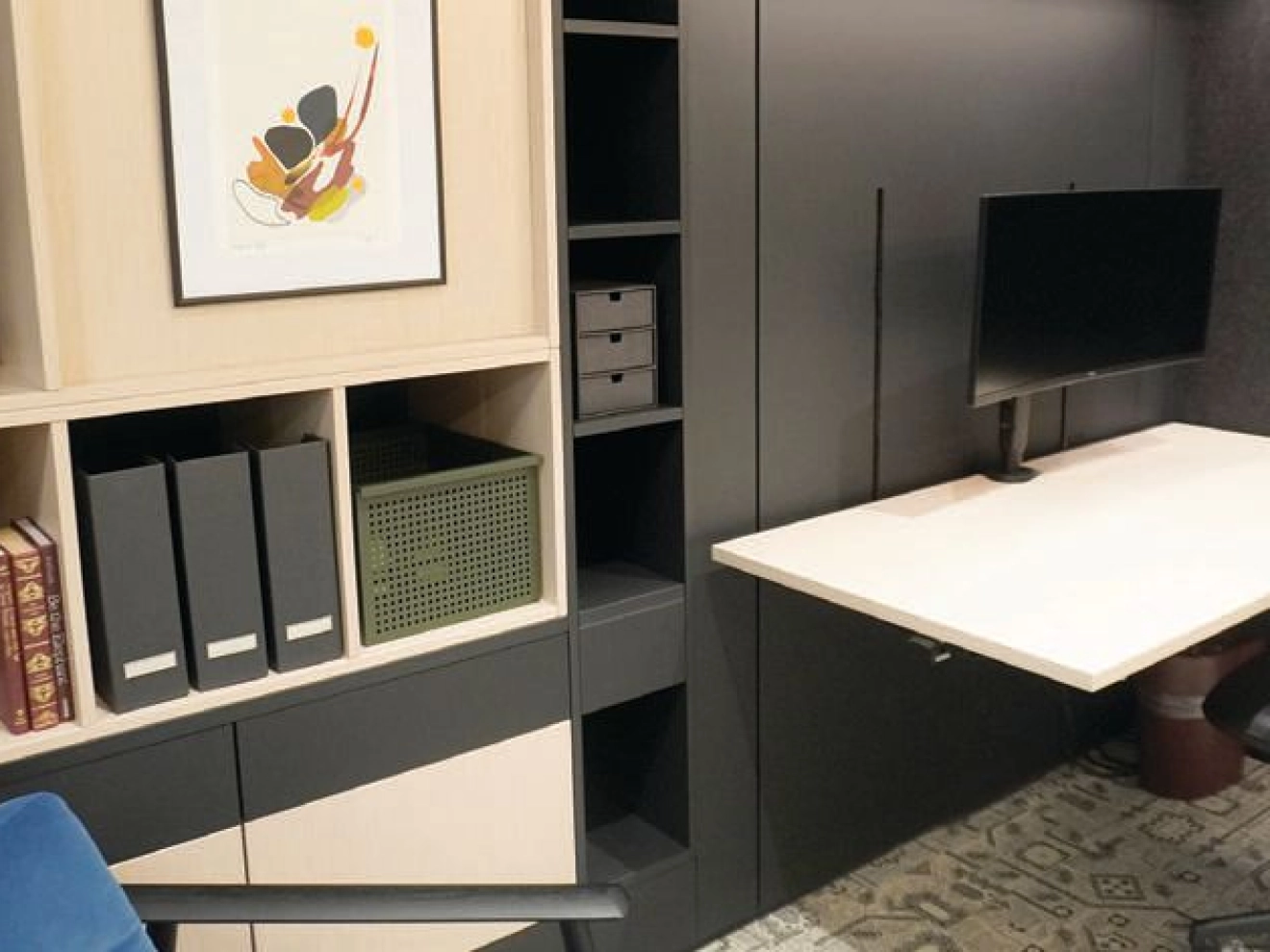 This work wall, featuring built-in shelving, integrated lighting and a height-adjustable surface, combines sleek design with high functionality, making even the smallest office footprint feel open and efficient. DIRRT office work wall with cantilevered desk PHOTO COURTESY OF WORKPLACE RESOURCES