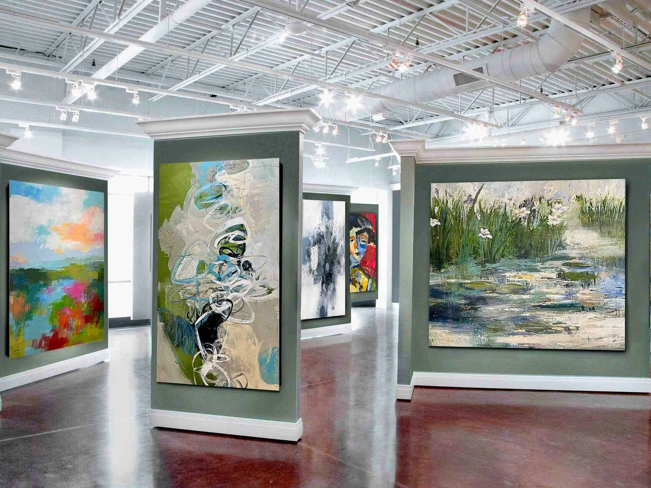 Modern art gallery interior featuring colorful abstract paintings displayed on freestanding walls.