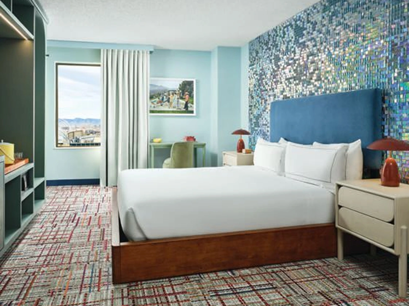 The Party Like a Rock Star room dazzles with a glittering disco-ball-inspired accent wall. PHOTO COURTESY OF THE CURTIS
