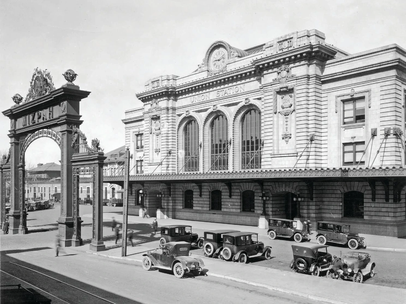 The Mizpah Arch stood in front of Union Station from 1906 to 1931, when it was deemed a traffic hazard. The iconic Travel by Train neon sign wouldn't be added until 1952. PHOTO COURTESY OF DENVER UNION STATION