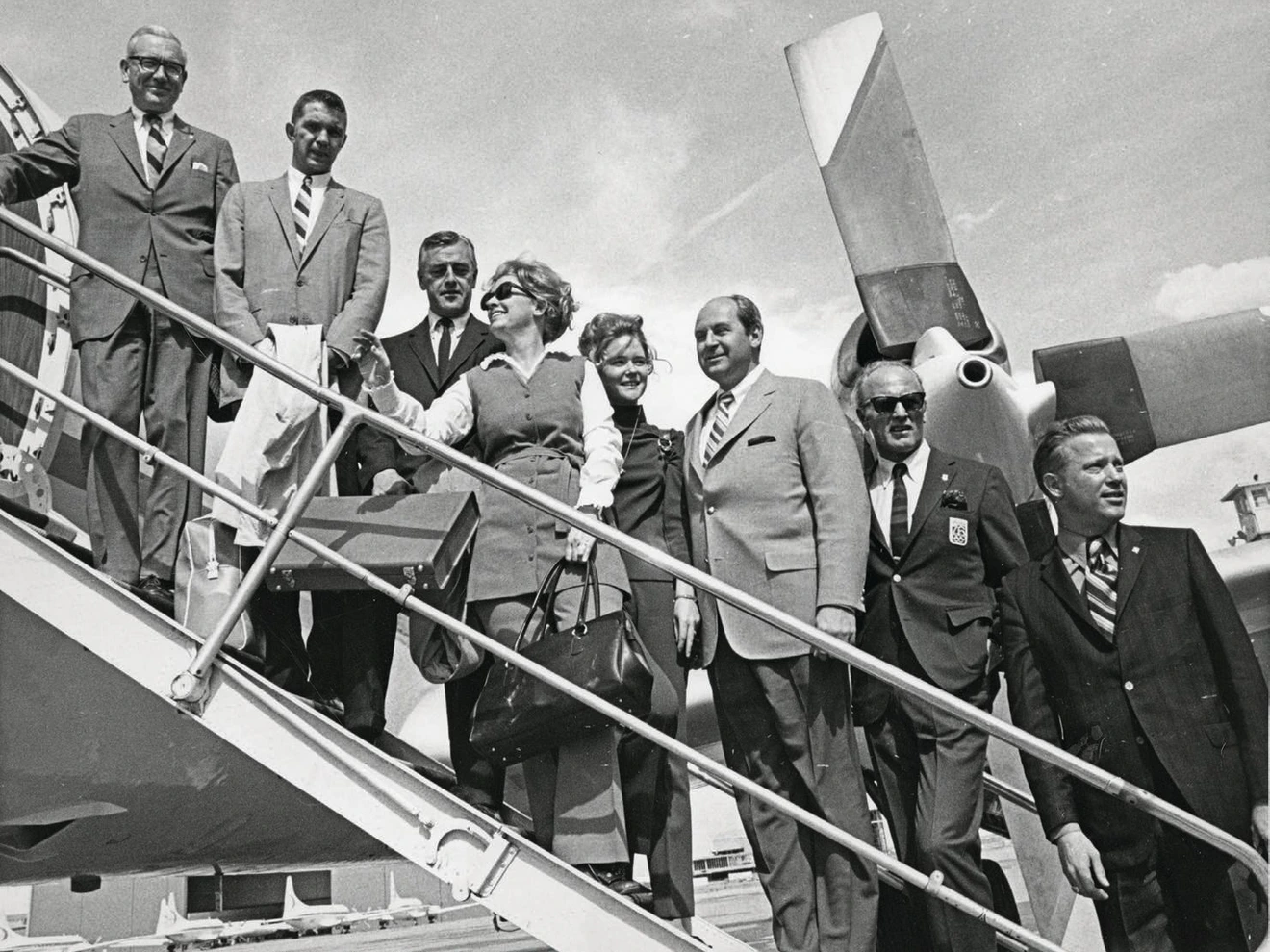 The Denver Olympic Committee, including University of Denver ski coach Willy Schaeffler (second from right), boards a plane for Amsterdam to make a pitch for the 1976 Winter Olympic Games. PHOTO COURTESY OF DENVER PUBLIC LIBRARY SPECIAL COLLECTIONS [WH2129-2018-366]
