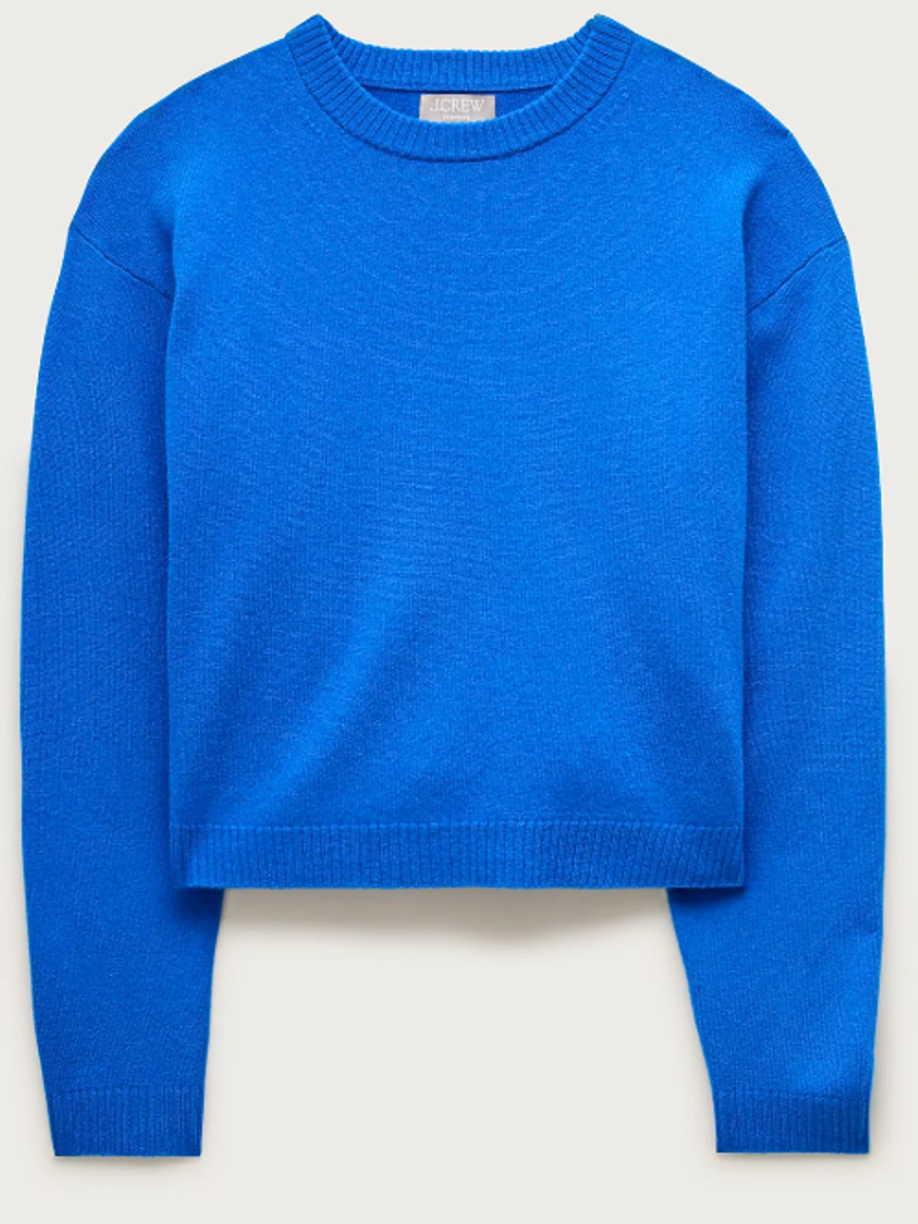Blue crewneck sweater with long sleeves, ribbed neckline, cuffs, and hem.