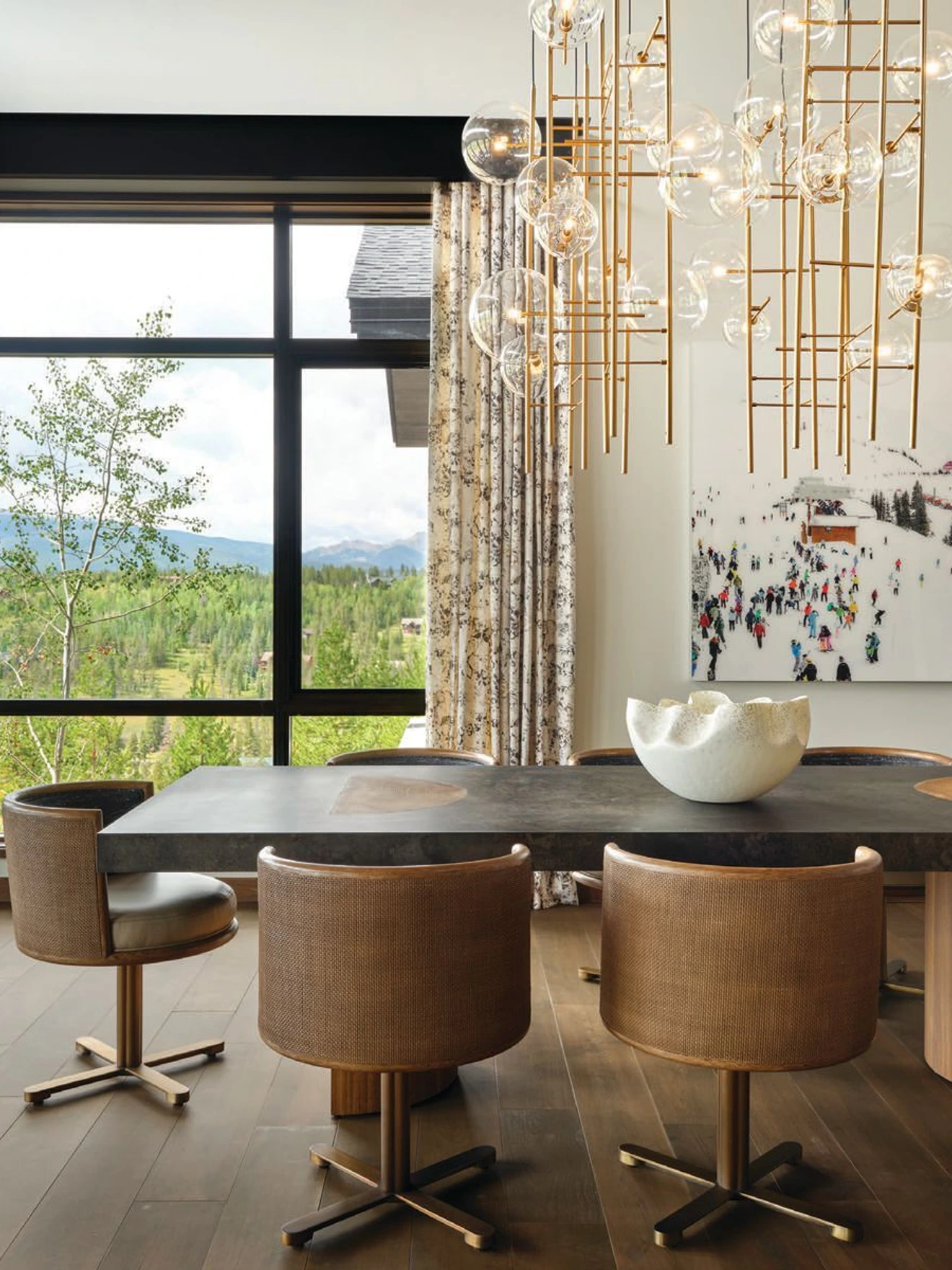 Lighting fixtures, like this modern chandelier from Alan Mizrahi, are well-scaled and intentional throughout. PHOTO BY DAVID PATTERSON