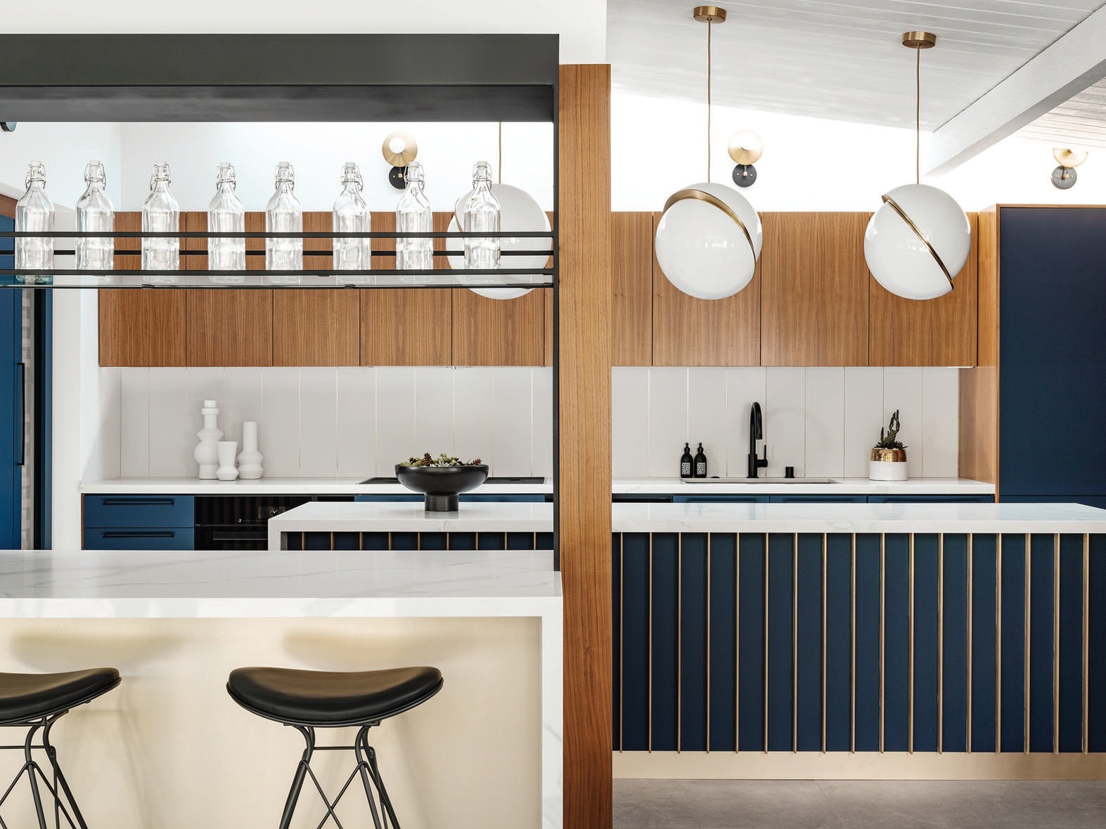 The kitchen cabinets are finished with matte black hardware by Nest Studio PHOTOGRAPHED BY LANCE GERBER