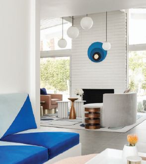 A view from the den into the living room frames the latter space’s 40-foot windows.“It’s the true definition of indoor-outdoor living,” says the designer. PHOTOGRAPHED BY LANCE GERBER