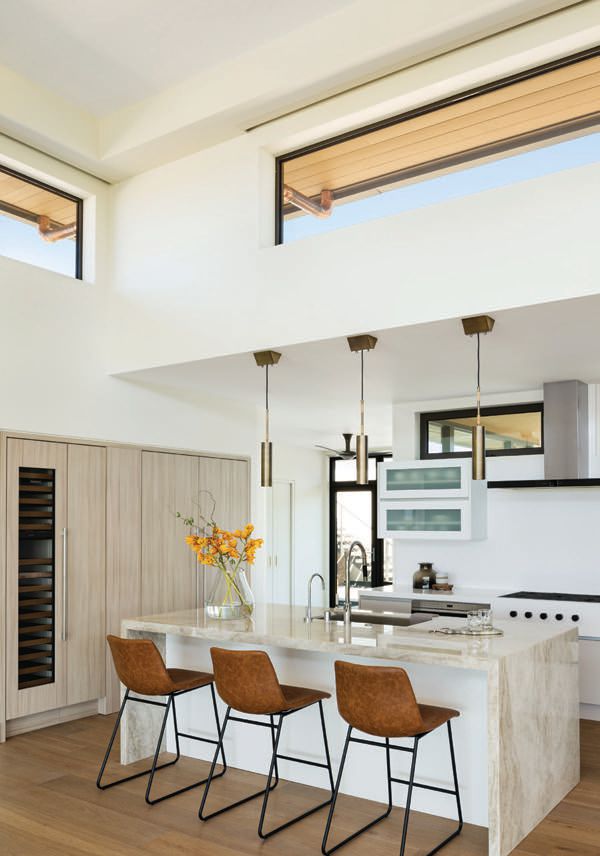 Recessed accent lighting at kitchen cabinetry illuminate. Photographed by Ethan Tweedie
