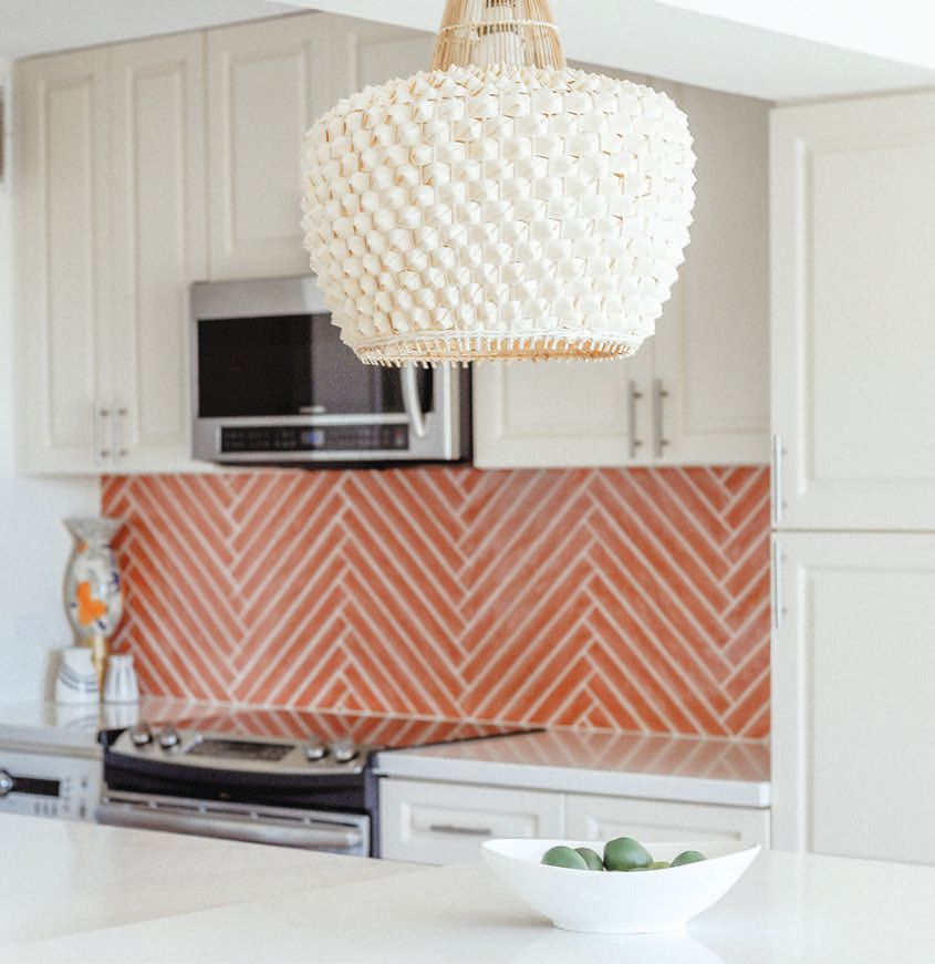 Selamat lighting carries the modern boho theme from the kitchen to the dining area. Photographed by Suarez Creative House