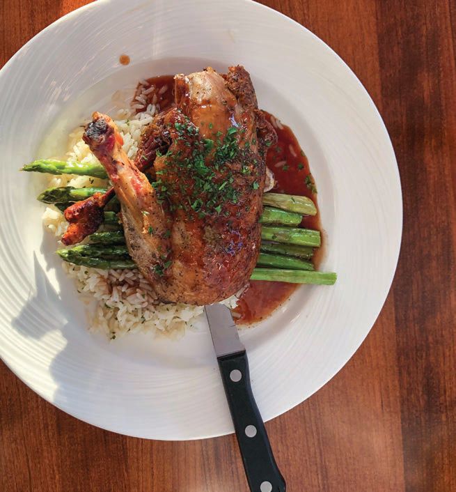 Indulge in dishes like the restaurant’s signature duck.