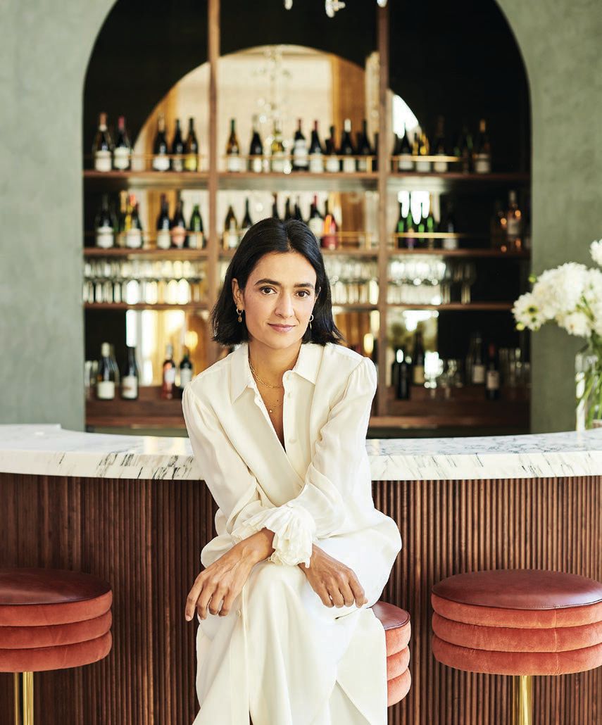 Vakili sits at the wine bar PHOTO BY ANTHONY TAHLIER