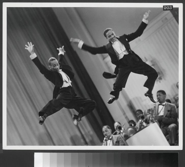 The Nicholas Brothers, Fayard Nicholas (left) and Harold Nicholas, in a scene from 1943’s Stormy Weather (photographic print, gelatin silver) PHOTO: COURTESY OF MARGARET HERRICK LIBRARY, © TWENTIETH CENTURY FOX