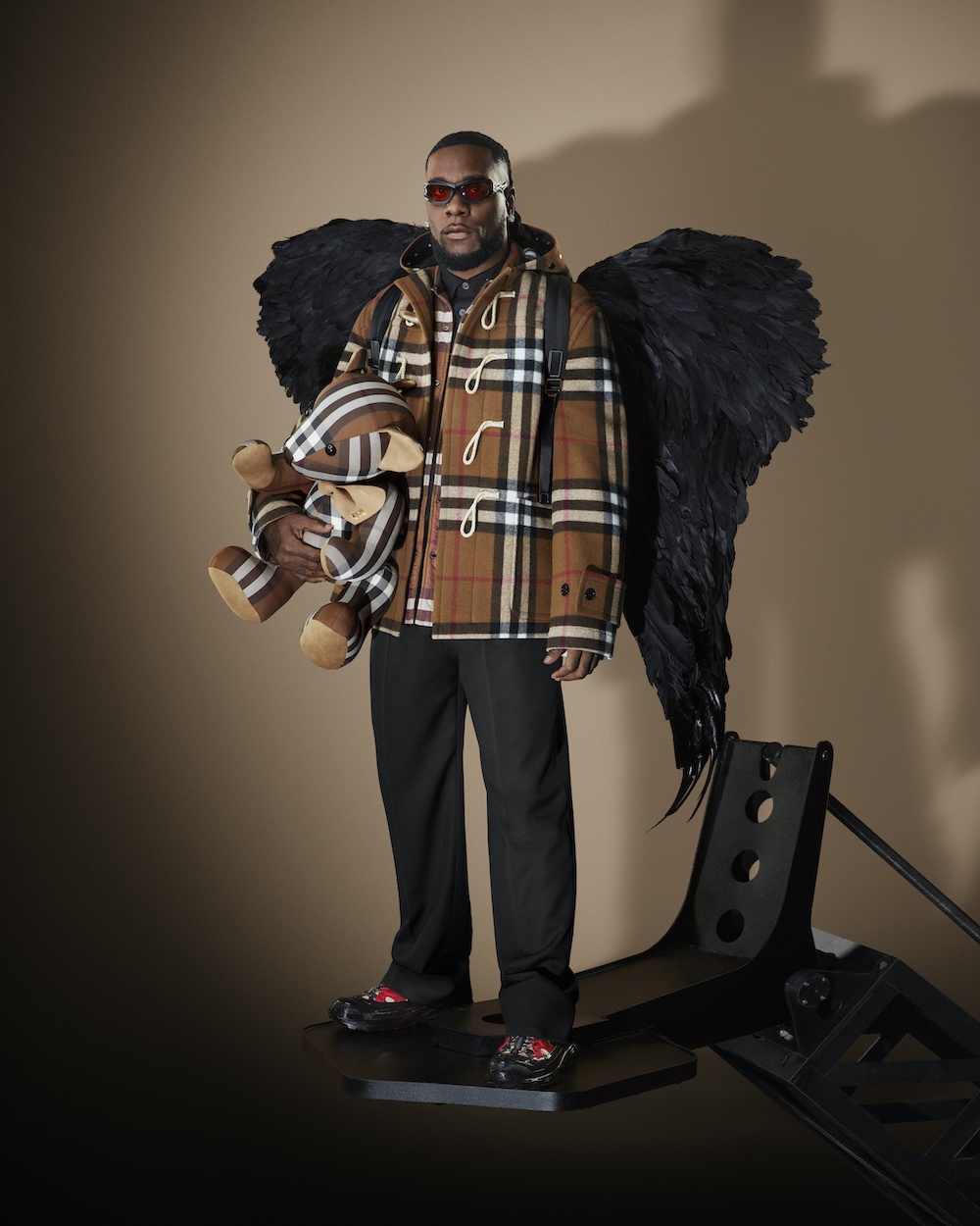 Burna Boy models the burberry 2022 holiday collection