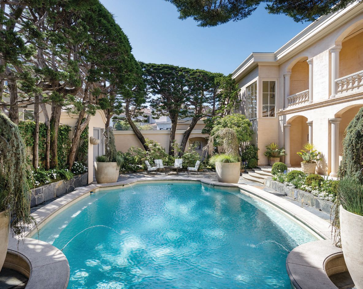 The private pool features an adjacent lounge and plenty of space for entertaining guests.