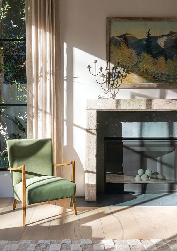 Brady incorporated pops of green throughout the living room, including an armchair from DeKor Living and a vintage art piece found at the Long Beach Antique Market. PHOTOGRAPHED BY TODD GOODMAN