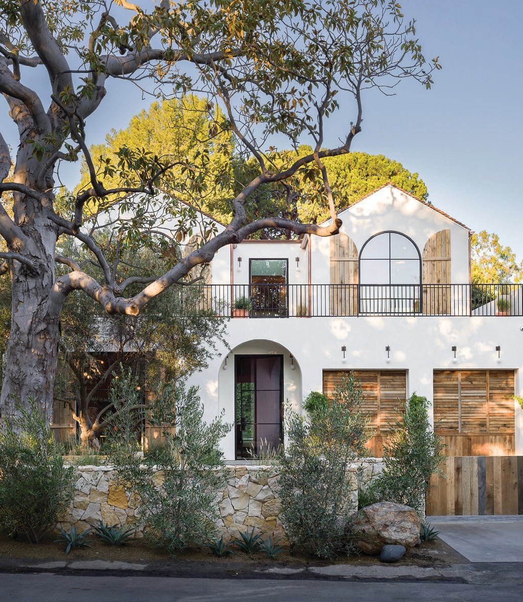 The exterior boasts natural limestone, old oak gates, and custom garage doors and shutters. “I truly believe that the exterior is the first chance you get to make an amazing first impression,” Diaz says PHOTOGRAPHED BY TODD GOODMAN