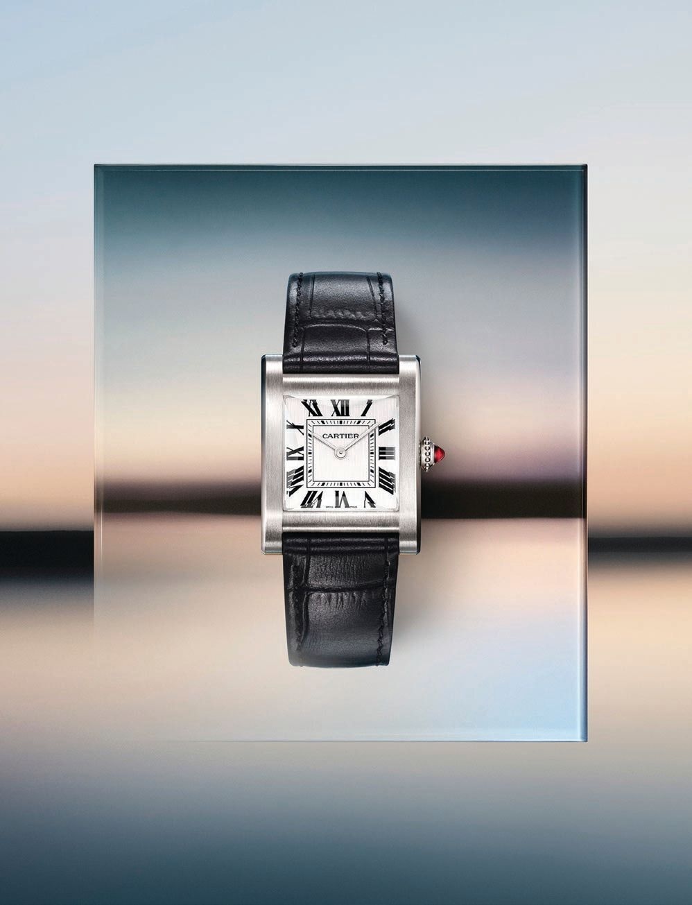 The Tank Normale is available in yellow gold on a brown alligator strap and platinum on a black alligator strap. PHOTO COURTESY OF CARTIER