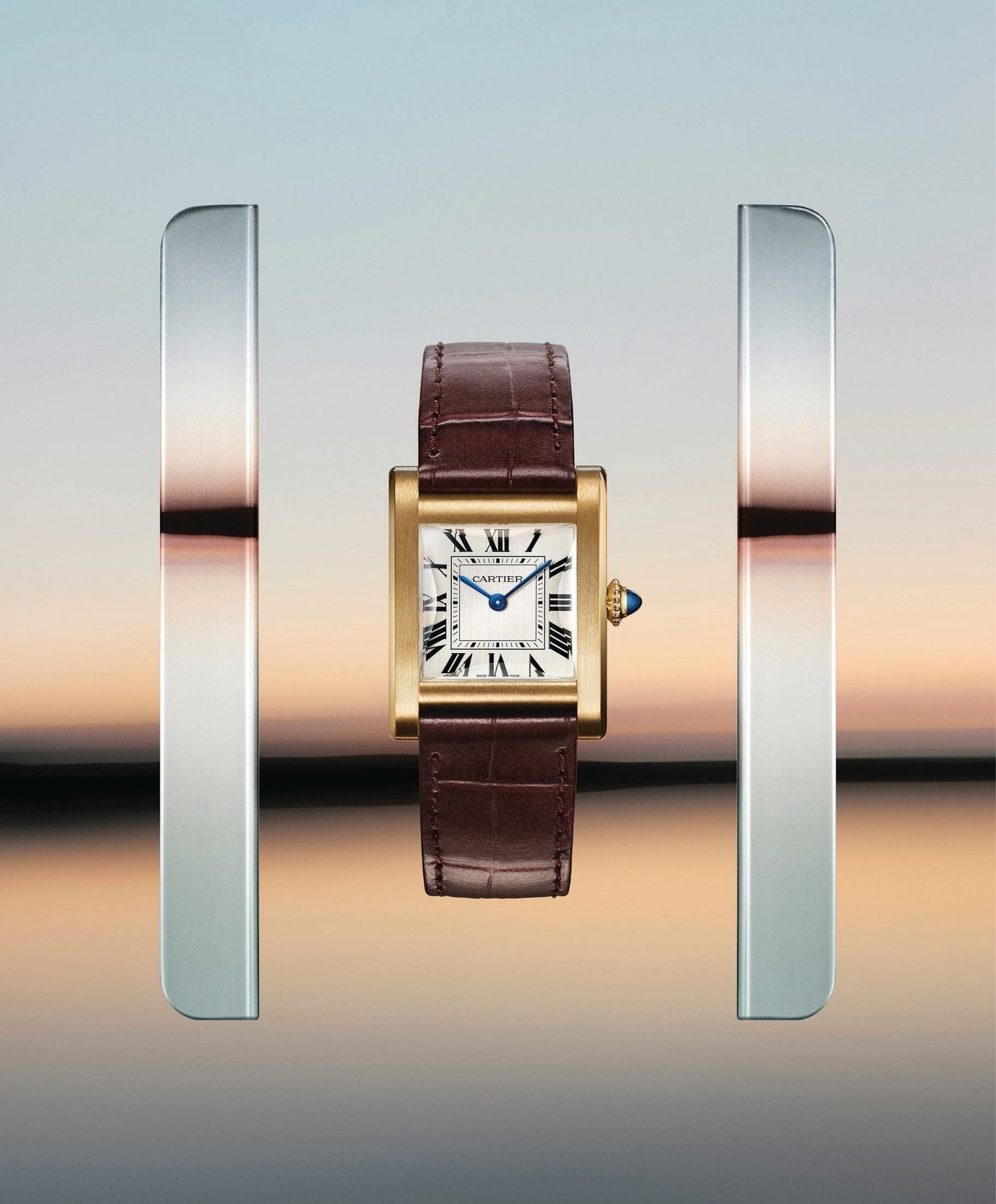 This year, Cartier has created an hour/ minute version that borrows from the proportions and beveled sapphire crystal of the original Tank Normale. PHOTO COURTESY OF CARTIER