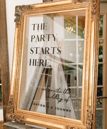 Mirrored signage designed by the bride and her cousin, 				Julia McGee