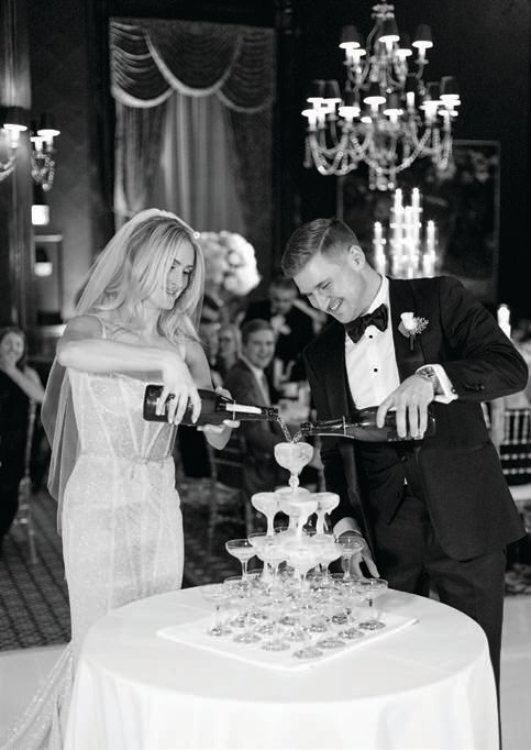 The couple poured Champagne down a tower of coupes;
