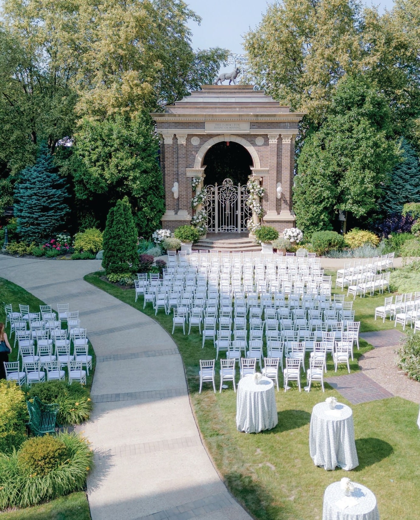The ceremony setup in the lush courtyard at Saint Ignatius. Photographed by Ben Finch