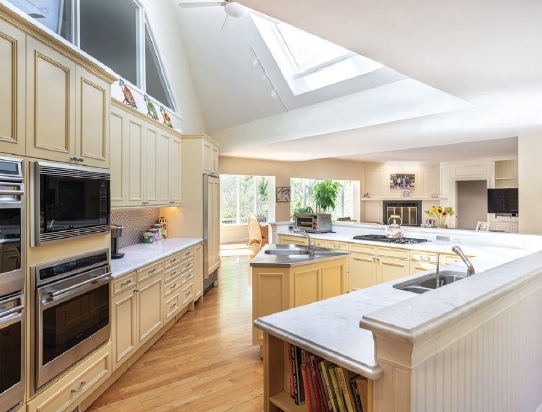 the kitchen features a skylight PHOTO BY DREW CALLAGHAN