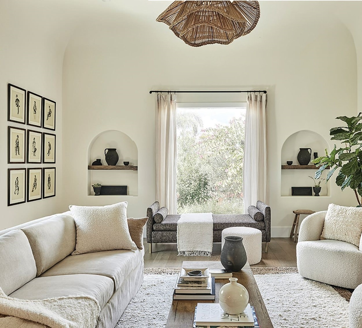 The living room contains an RH sofa and coffee table, accent 				pieces from Fragments Identity and a Rugs USA rug PHOTOGRAPHED BY JENNA PEFFLEY