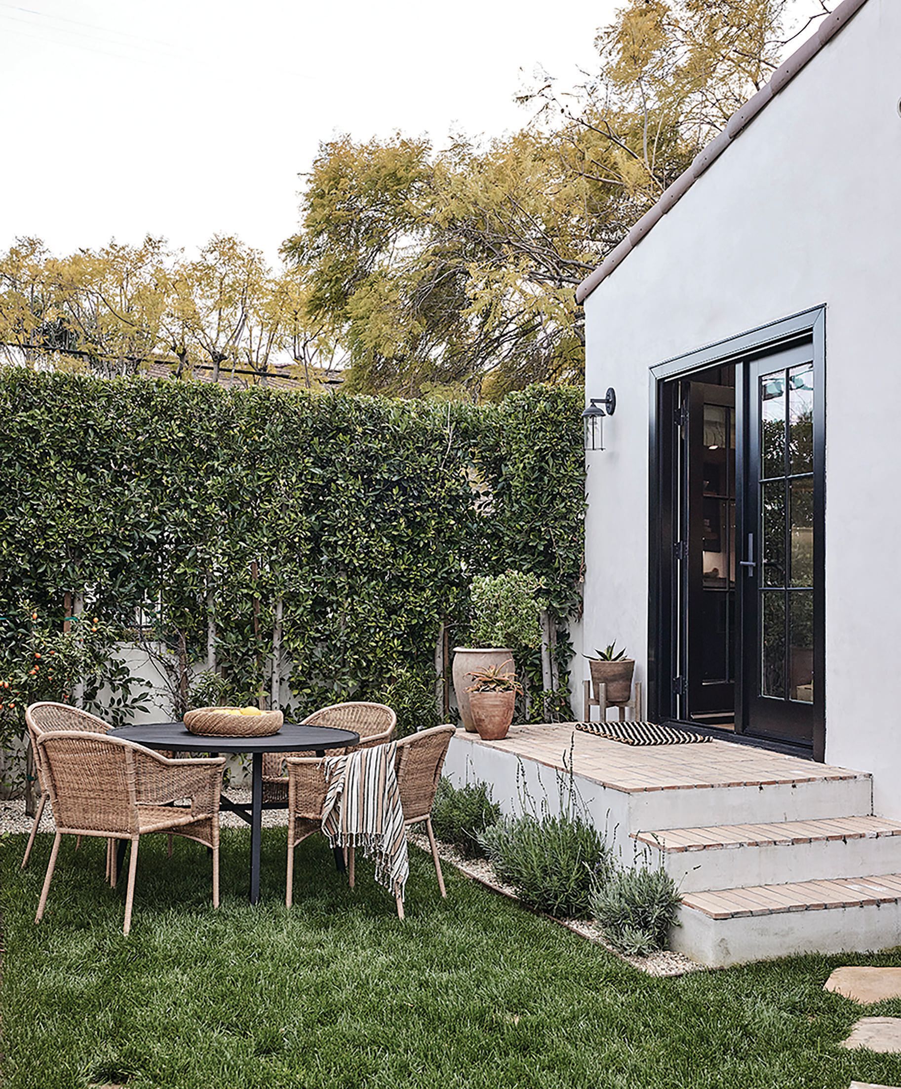 The outdoor 				areas are filled 				with pieces by 				Fragments Identity, 				RH, West Elm and 				Rugs USA. PHOTOGRAPHED BY JENNA PEFFLEY