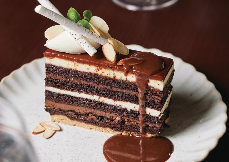 treat yourself to La Padrona’s devil’s food cake with chocolate ganache, mascarpone and almond feuilletine BRIAN SAMUELS