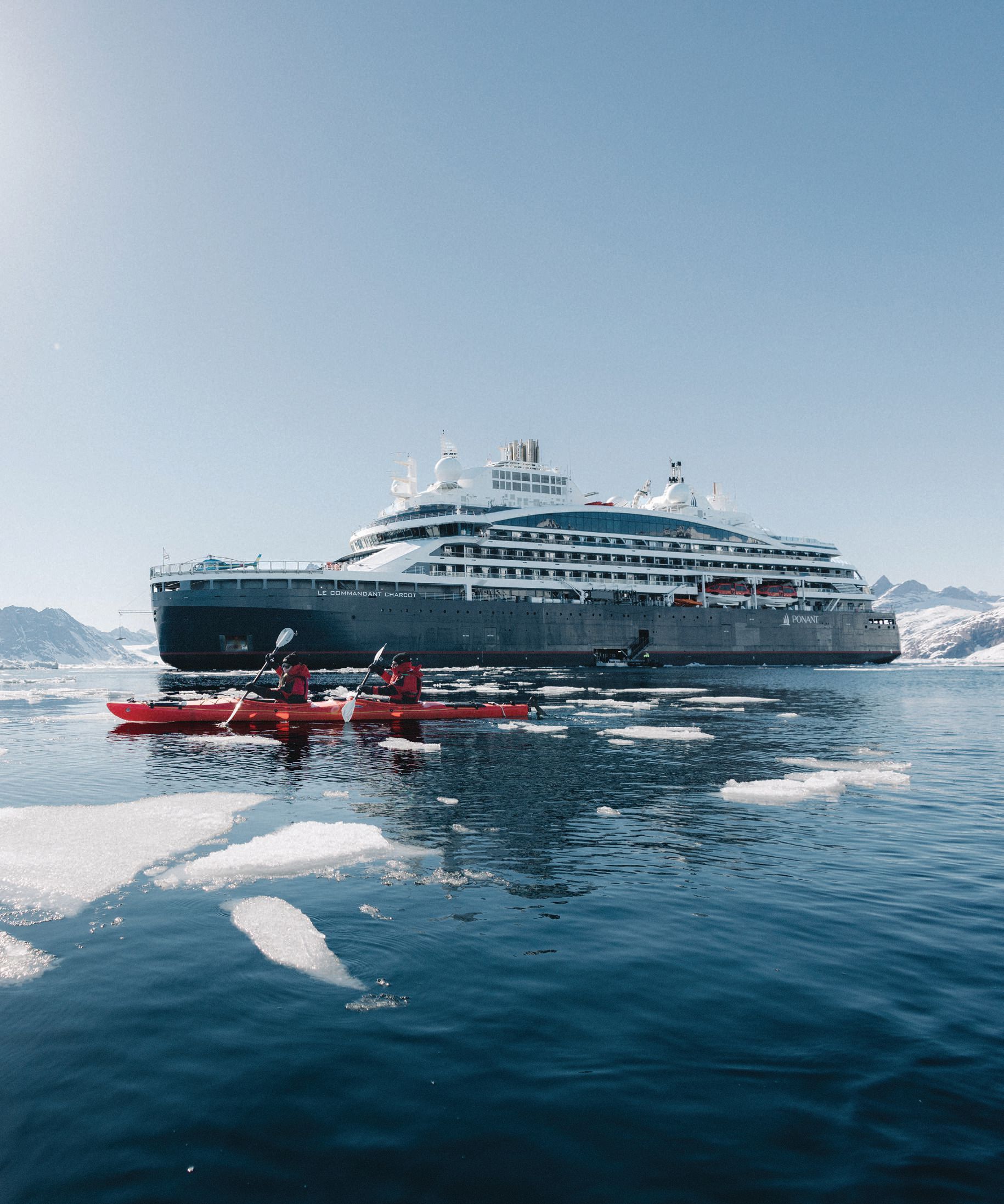 Kayakers explore the waters off Storo Island, Greenland, on a Ponant cruise. PHOTO BY DANIEL ERNST/©PONANT