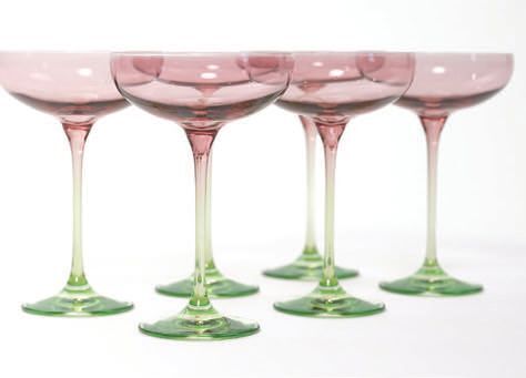 Colored Champagne Coupes: "Estelle Colored Glass is one of our favorite Black-owned businesses, with stunning glassware in soft colorful hues and sculptural silhouettes. Estellecoloredglass.com