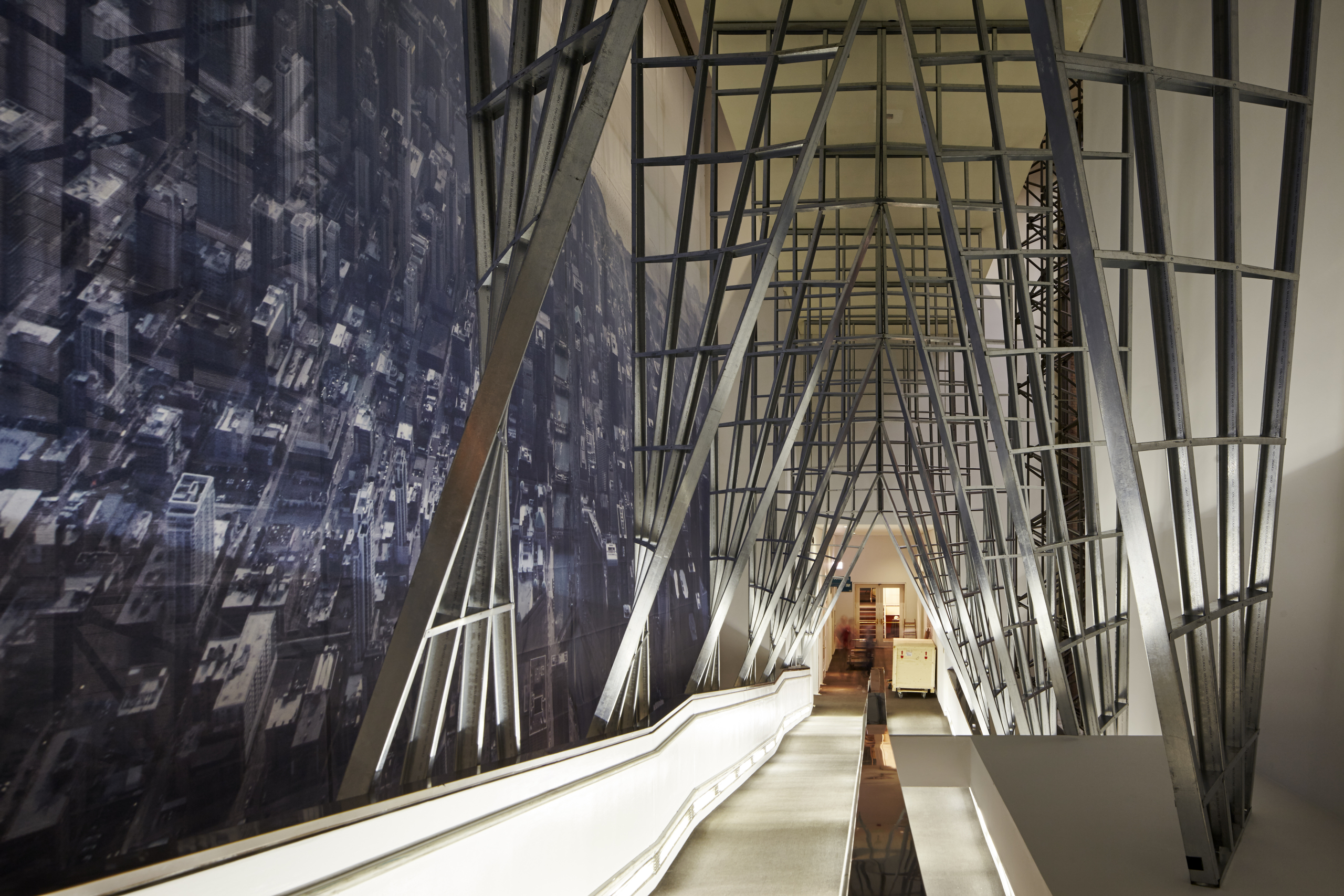 "Passage," an immersive installation at the Chicago Cultural Center set before an aerial photograph of the Chicago skyline taken by Iwan Baan.